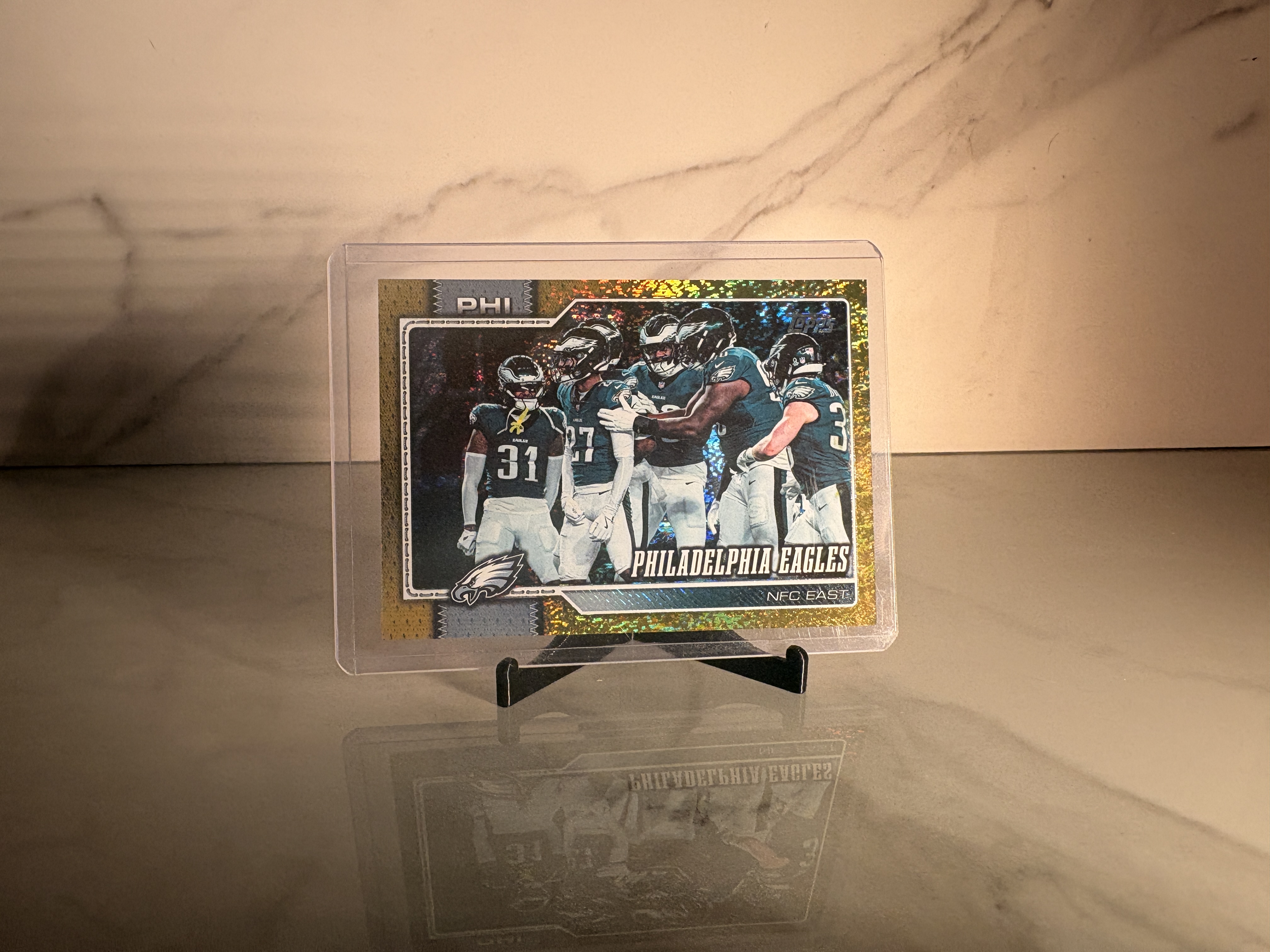 Front view of 2026 Topps Flagship Football Eagles Team Card Gold Sandglitter Parallel /50